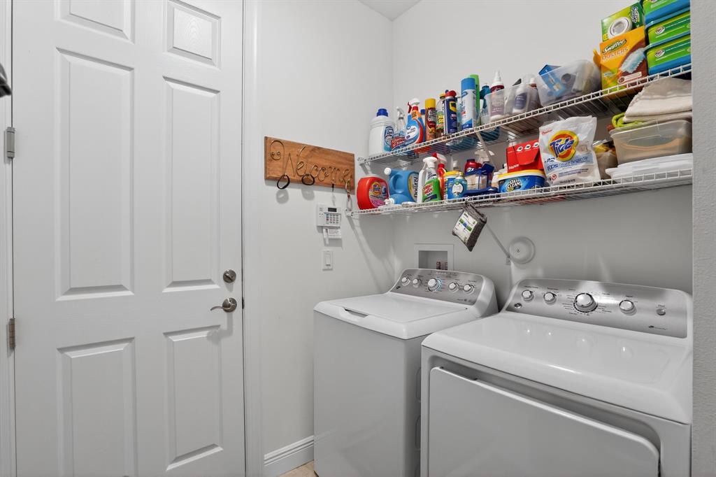 21044 Southwest Modena Way Port St. Lucie, FL 34986 - Photo 31 of 42 a utility room with dryer and washer