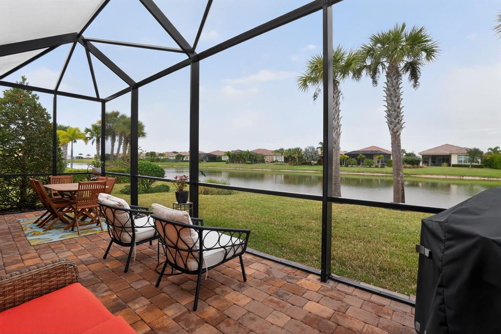 21044 Southwest Modena Way Port St. Lucie, FL 34986 - Photo 34 of 42 a view of lake from balcony with seating space