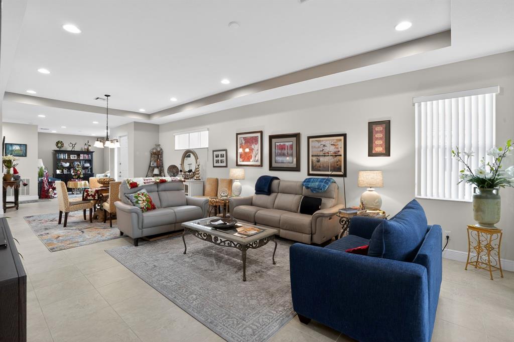 21044 Southwest Modena Way Port St. Lucie, FL 34986 - Photo 7 of 42 a living room with furniture and a large window
