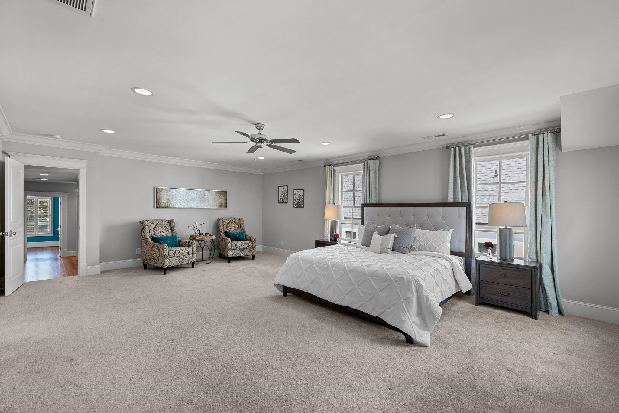 2116 Cowper Drive Raleigh, NC 27608 - Photo 7 of 65 The owner's suite boasts a large footprint and a the most luxurious spa-like primary bathroom. It also has a walk-in closet that goes on and on - providing plenty of space for any wardrobe. Primary Bedroom