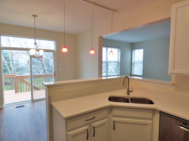 267 Grand Ridge Road St. Charles, IL 60175 - Photo 13 of 41 a kitchen with a sink and large windows