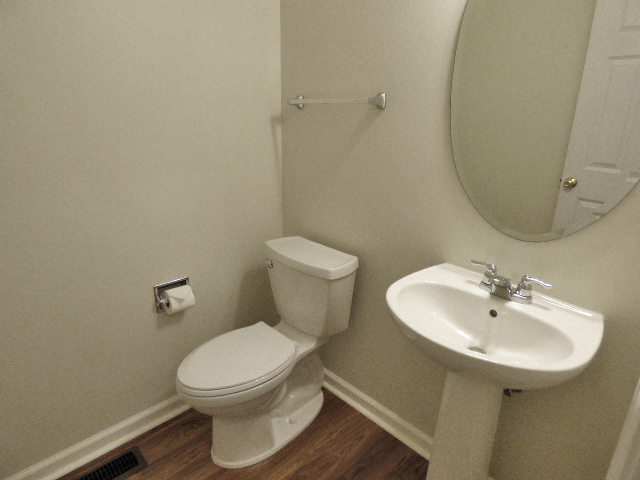 267 Grand Ridge Road St. Charles, IL 60175 - Photo 18 of 41 a bathroom with a toilet sink and mirror