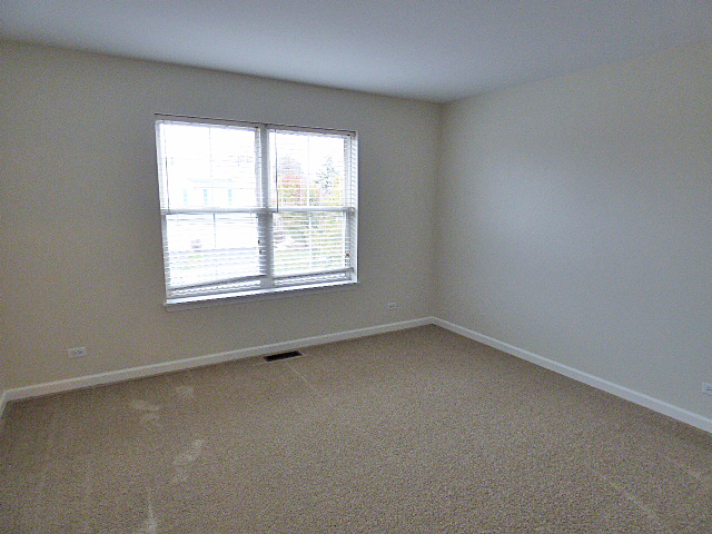267 Grand Ridge Road St. Charles, IL 60175 - Photo 30 of 41 an empty room with a window