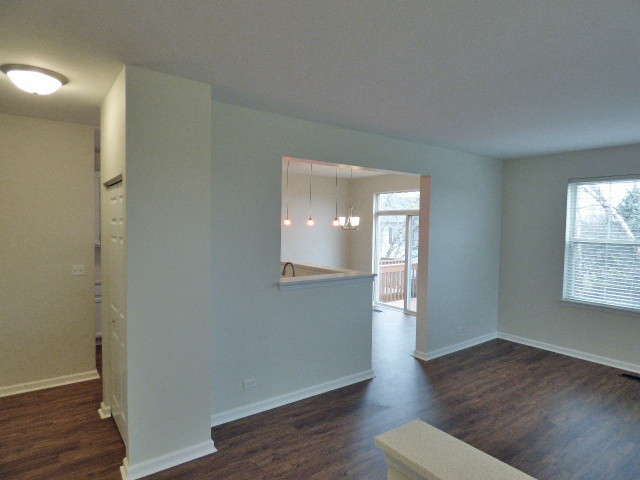 267 Grand Ridge Road St. Charles, IL 60175 - Photo 5 of 41 an empty room with wooden floor and windows