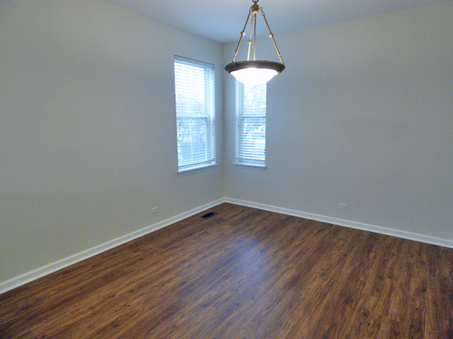 267 Grand Ridge Road St. Charles, IL 60175 - Photo 9 of 41 an empty room with wooden floor and a window