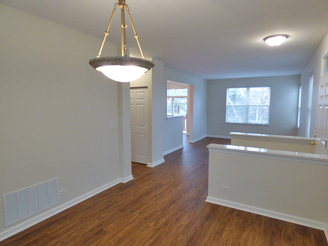 267 Grand Ridge Road St. Charles, IL 60175 - Photo 10 of 41 an empty room with wooden floor and windows