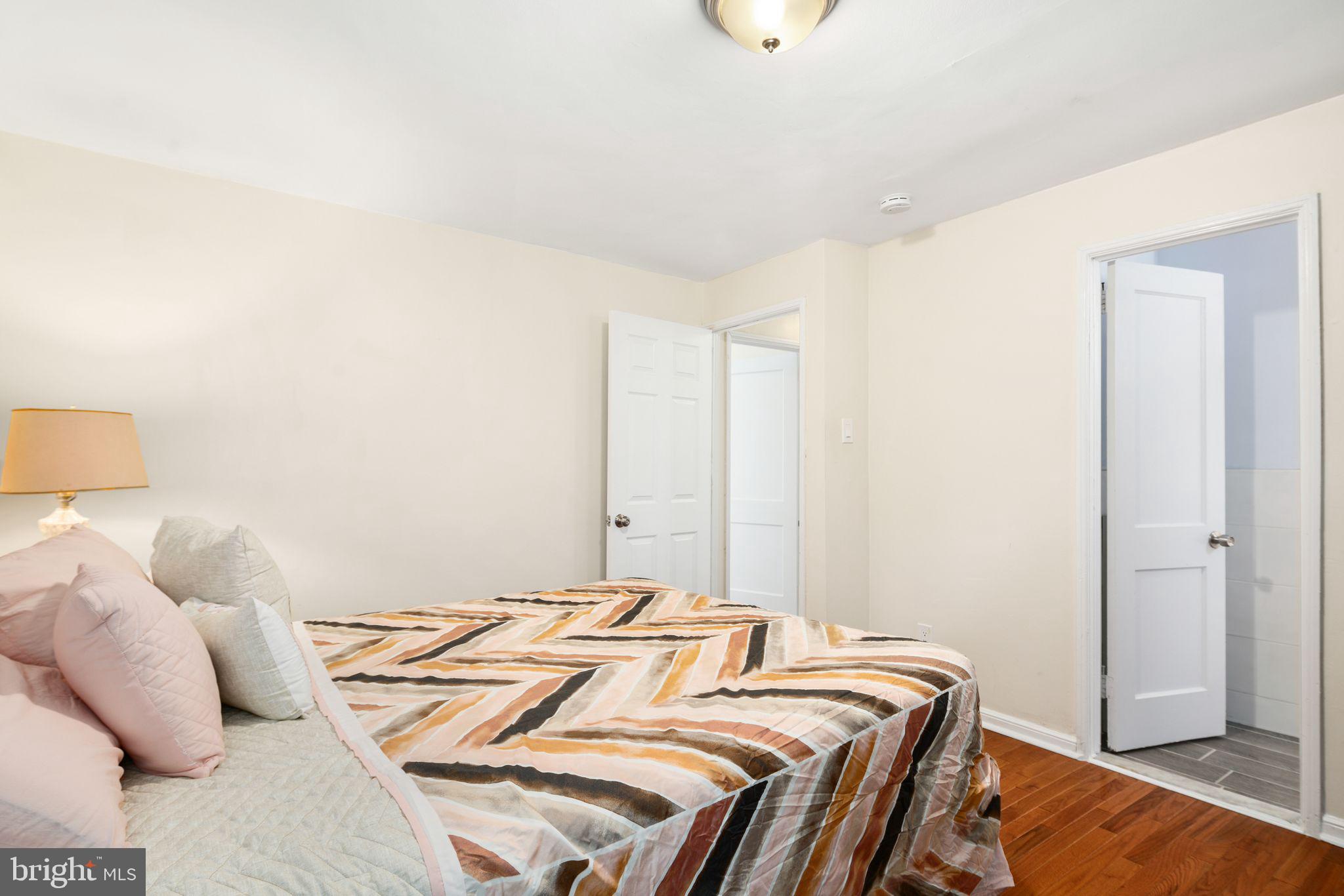 13 Rodney Road Bryn Mawr, PA 19010 - Photo 17 of 42 a bedroom with a bed and wooden floor