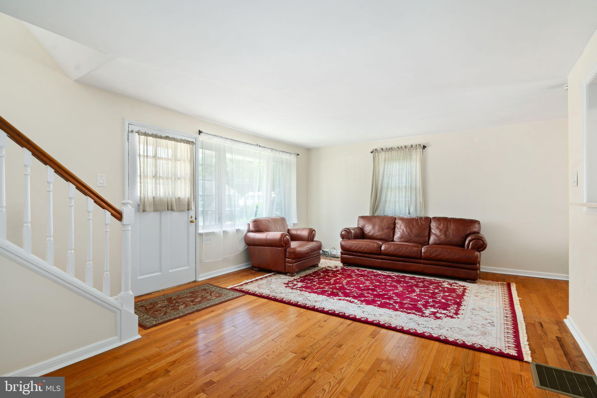 13 Rodney Road Bryn Mawr, PA 19010 - Photo 5 of 42 a living room with furniture and a rug