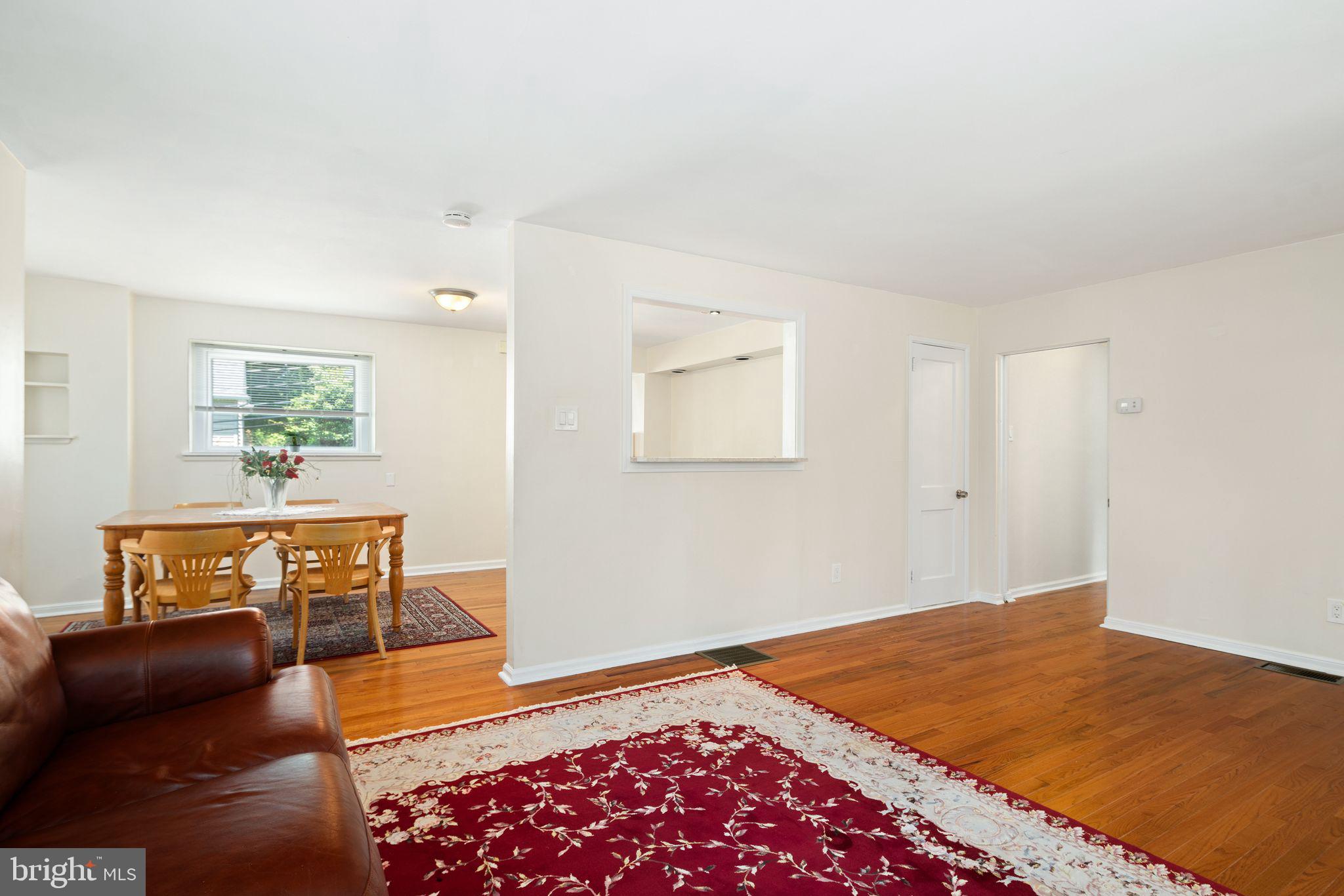 13 Rodney Road Bryn Mawr, PA 19010 - Photo 6 of 42 a bedroom with a bed and wooden floor