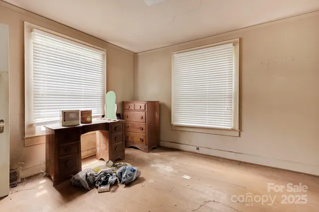 a room with a bed and a chair