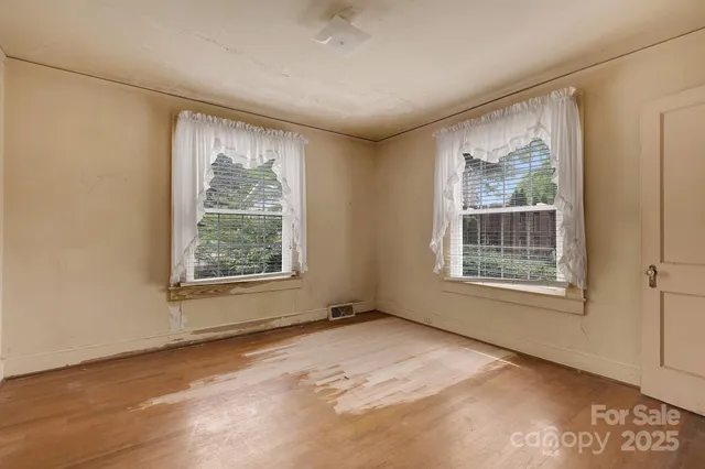 a view of livingroom with workspace and a window