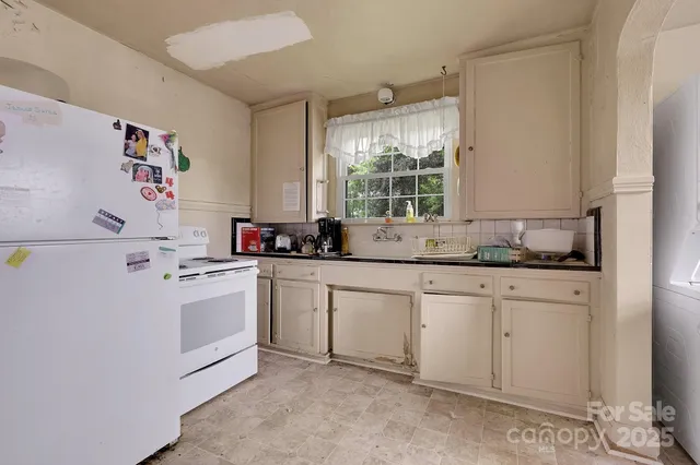 a kitchen with sink cabinets and window