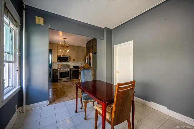 a kitchen with granite countertop cabinets and refrigerator