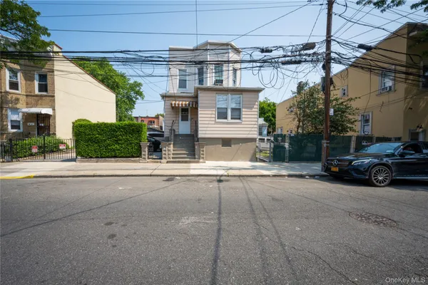 a view of a car park in front of a house
