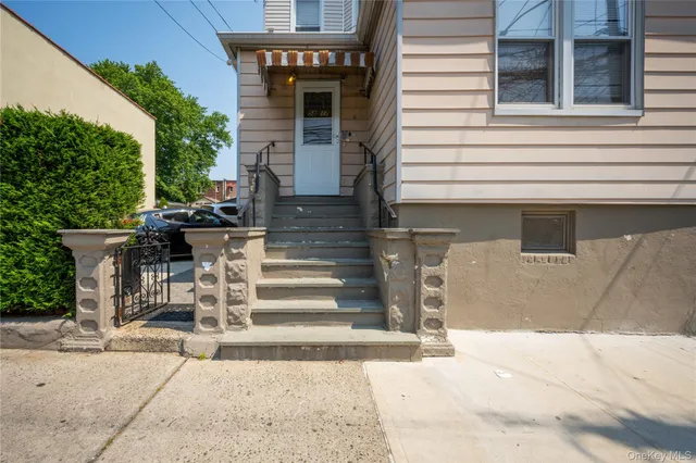 a view of entrance gate of a house with a street