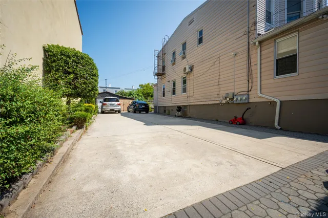 a backyard of a house with yard and outdoor seating