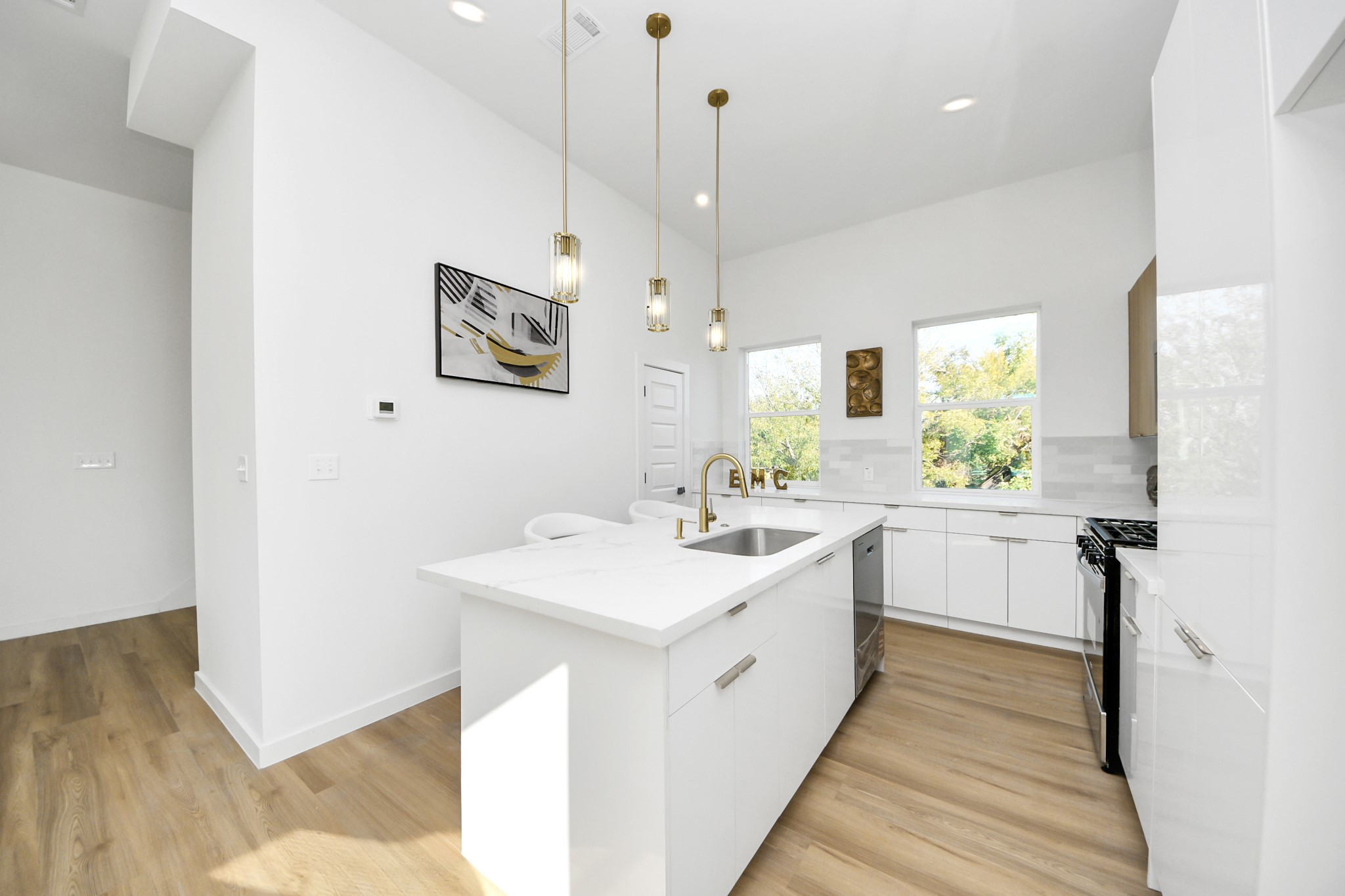 1216 East 34th Street, Unit B Houston, TX 77022 - Photo 16 of 42 a view of a kitchen sink and wooden floor