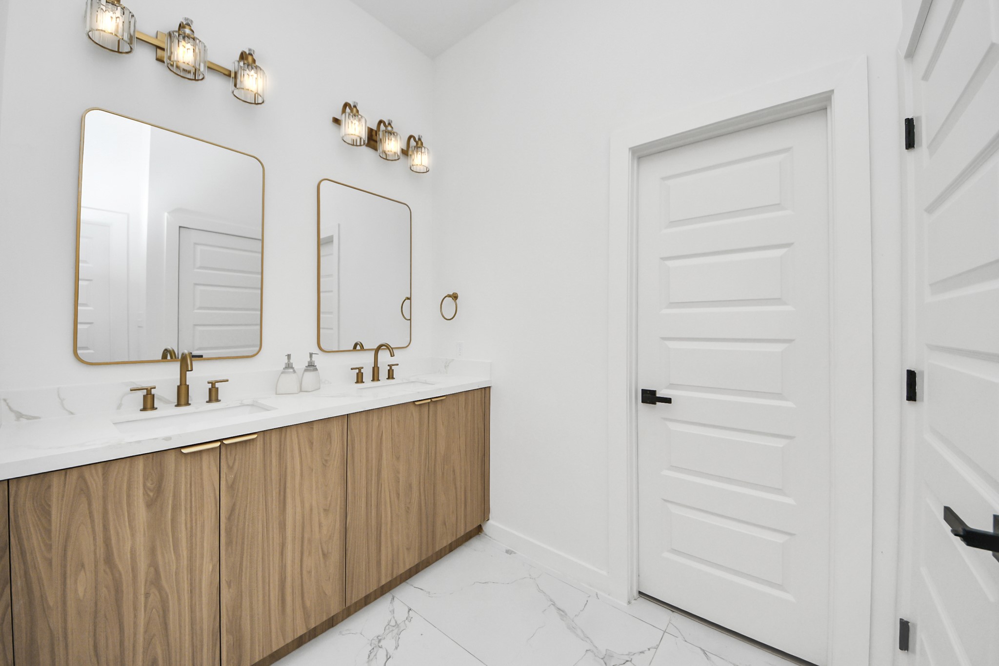 1216 East 34th Street, Unit B Houston, TX 77022 - Photo 29 of 42 a bathroom with a double vanity sink and a mirror