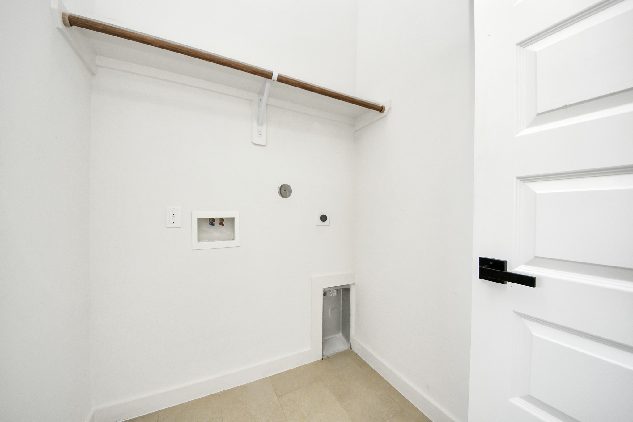 1216 East 34th Street, Unit B Houston, TX 77022 - Photo 31 of 42 a view of small space with racks on the wall