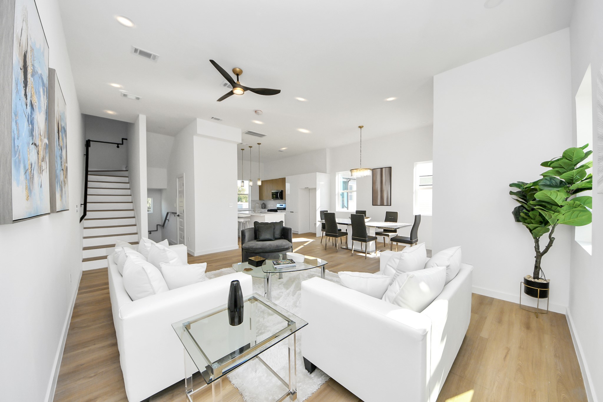 1216 East 34th Street, Unit B Houston, TX 77022 - Photo 9 of 42 a living room with furniture potted plant and a large window