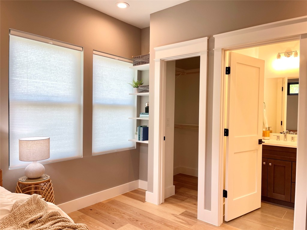 3405 Woodrow Street Austin, TX 78705 - Photo 13 of 13 a bedroom with a bed and a mirror