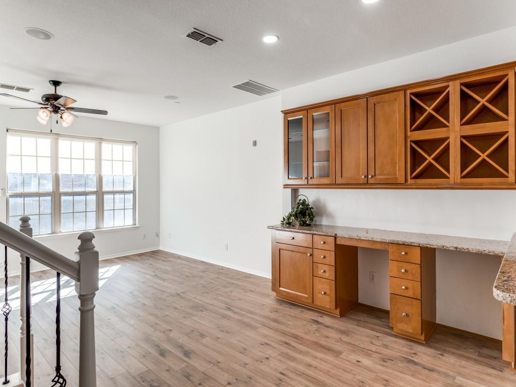 3942 Sugar Tree Way Addison, TX 75001 - Photo 13 of 31 a kitchen with stainless steel appliances granite countertop a sink cabinets and wooden floor