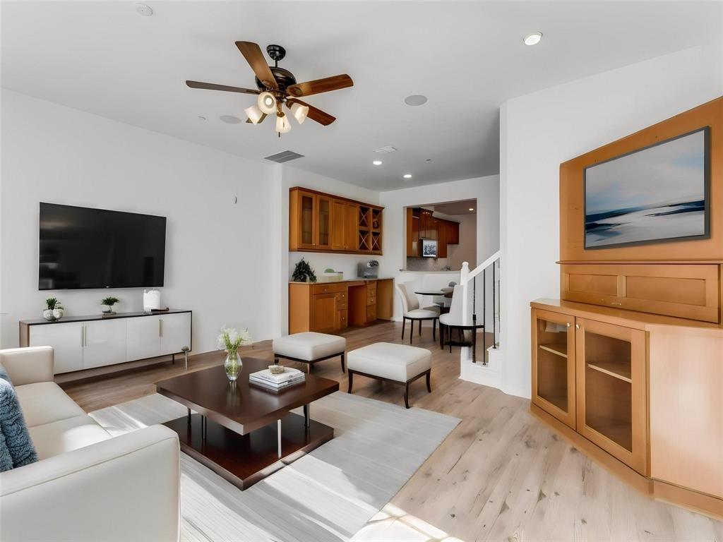 3942 Sugar Tree Way Addison, TX 75001 - Photo 15 of 31 a living room with furniture kitchen view and a flat screen tv