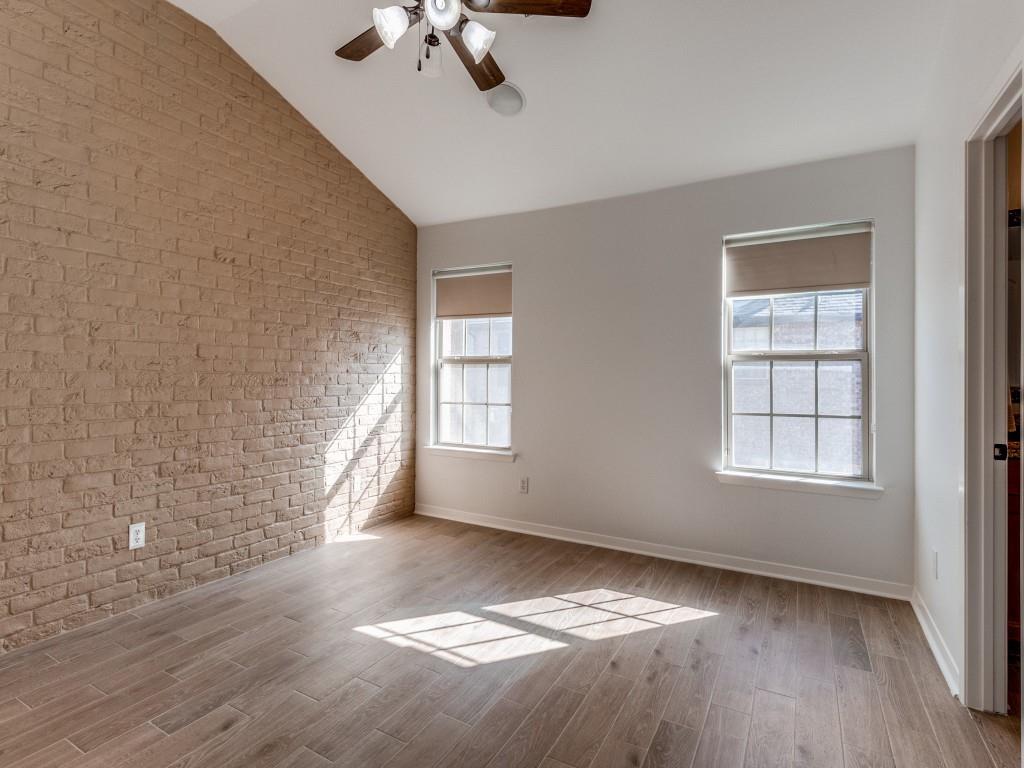 3942 Sugar Tree Way Addison, TX 75001 - Photo 23 of 31 an empty room with windows and chandelier fan