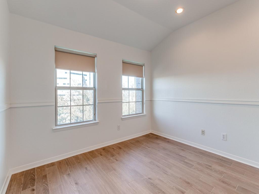 3942 Sugar Tree Way Addison, TX 75001 - Photo 26 of 31 an empty room with wooden floor and windows