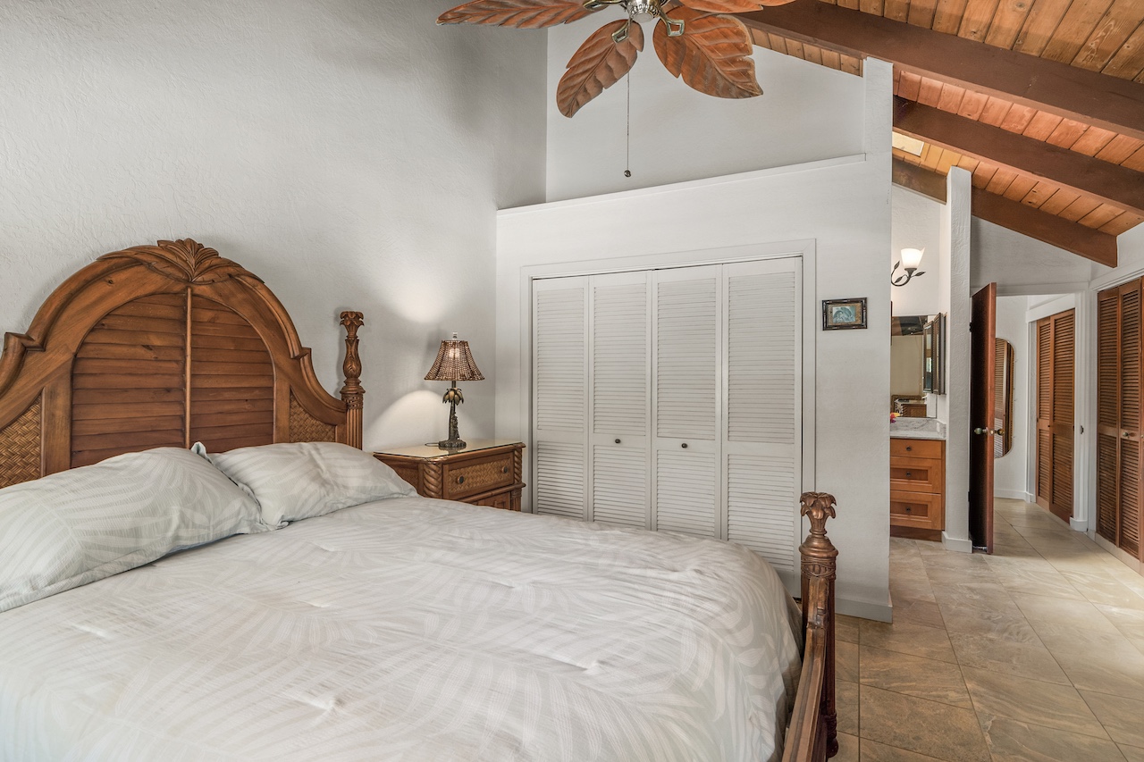 2330 Ho'ohu Road, Unit 5 Koloa, HI 96756 - Photo 14 of 28 a bedroom with a bed and a large mirror