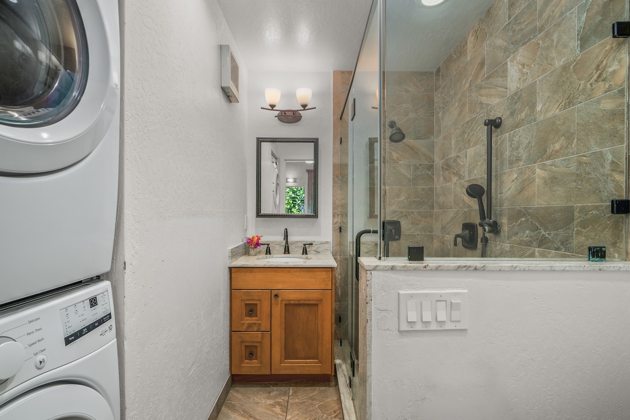 2330 Ho'ohu Road, Unit 5 Koloa, HI 96756 - Photo 18 of 28 a bathroom with a sink a toilet and a mirror