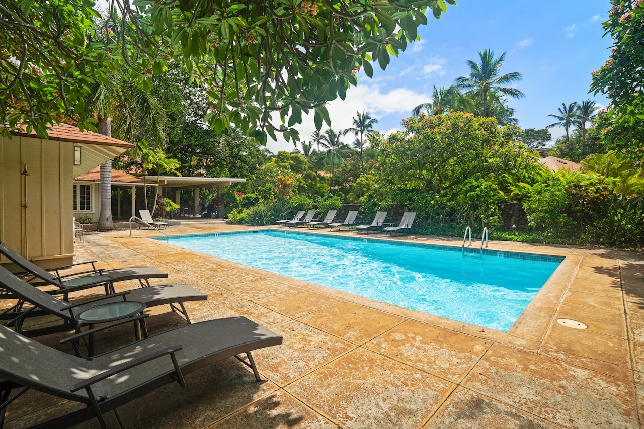 2330 Ho'ohu Road, Unit 5 Koloa, HI 96756 - Photo 22 of 28 a view of a swimming pool with lounge chair