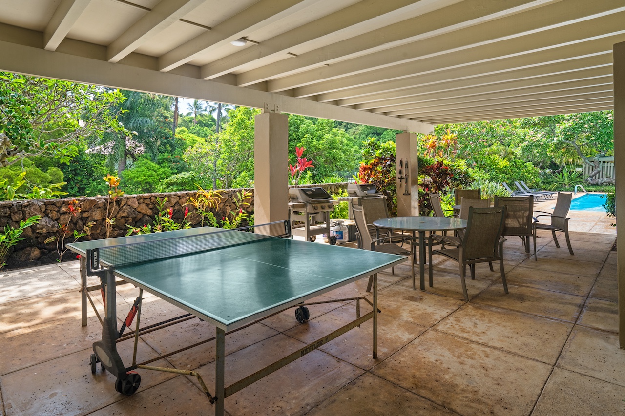 2330 Ho'ohu Road, Unit 5 Koloa, HI 96756 - Photo 23 of 28 a view of a patio with a table and chairs