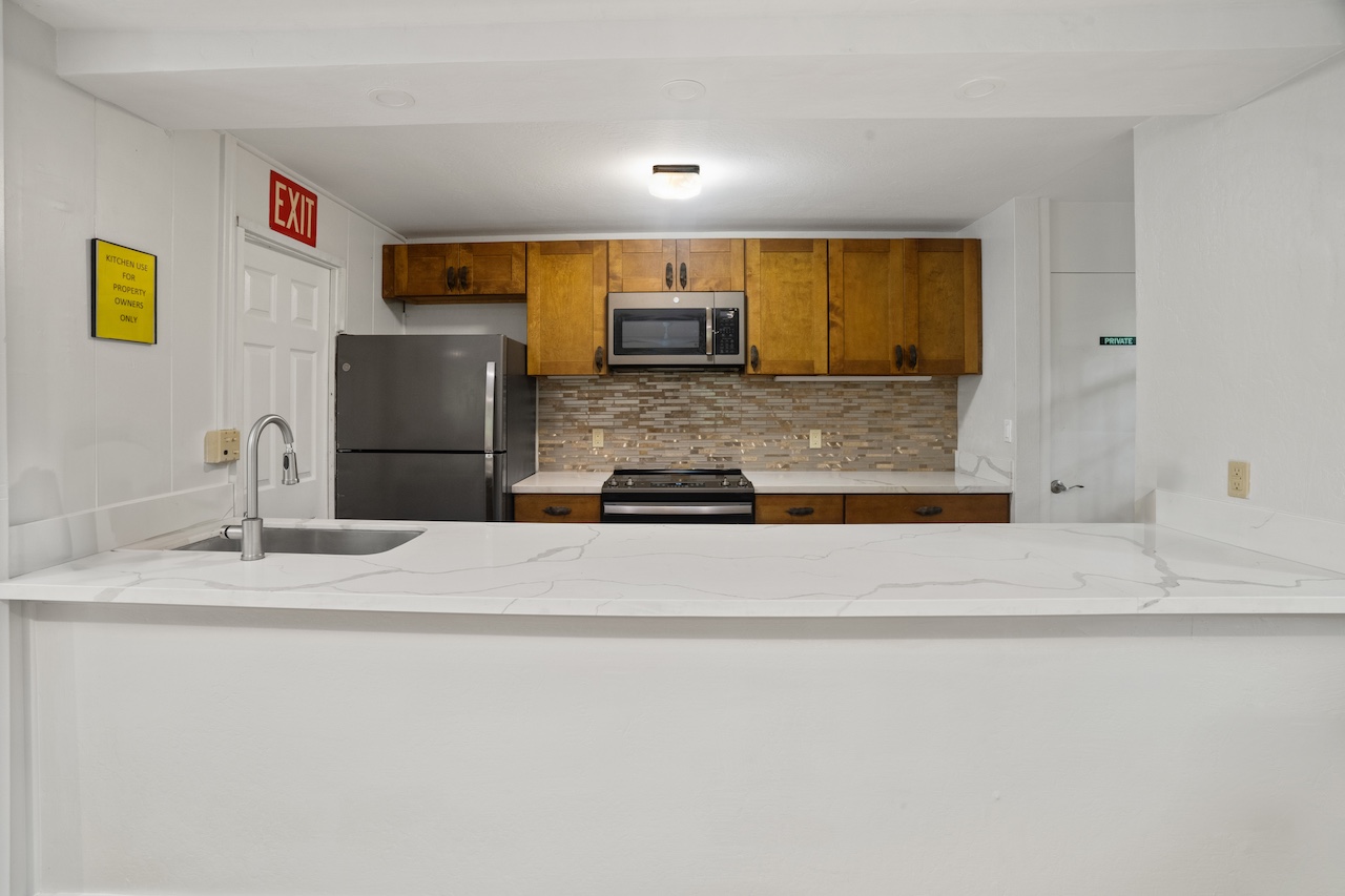 2330 Ho'ohu Road, Unit 5 Koloa, HI 96756 - Photo 27 of 28 a bathroom with a sink and a mirror