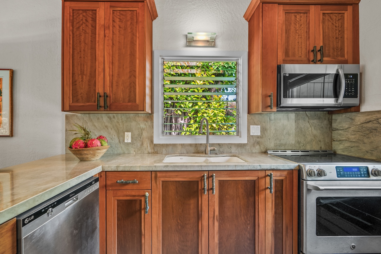 2330 Ho'ohu Road, Unit 5 Koloa, HI 96756 - Photo 6 of 28 a kitchen with a sink cabinets and window