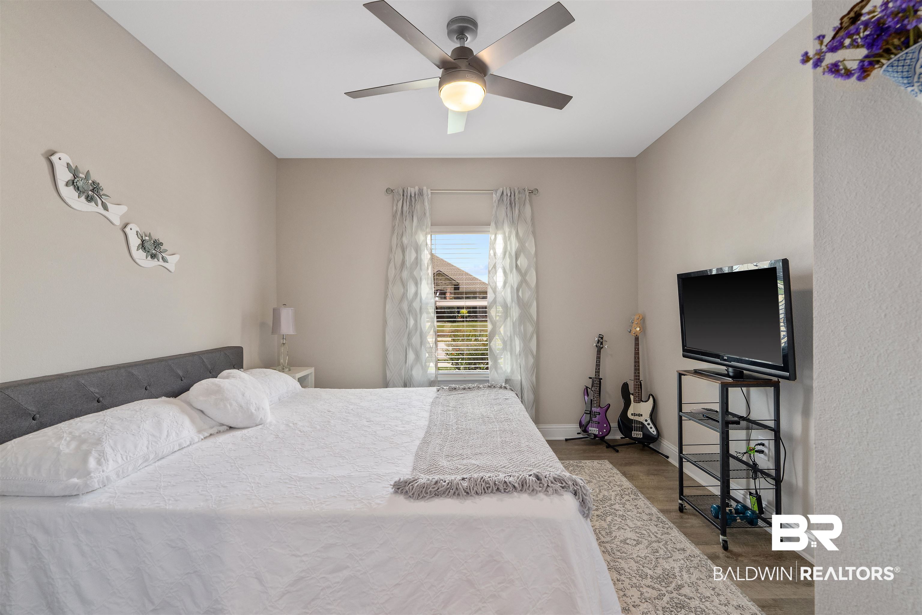 24593 Slater Mill Road Daphne, AL 36526 - Photo 20 of 32 Bedroom featuring wood finished floors and a ceiling fan