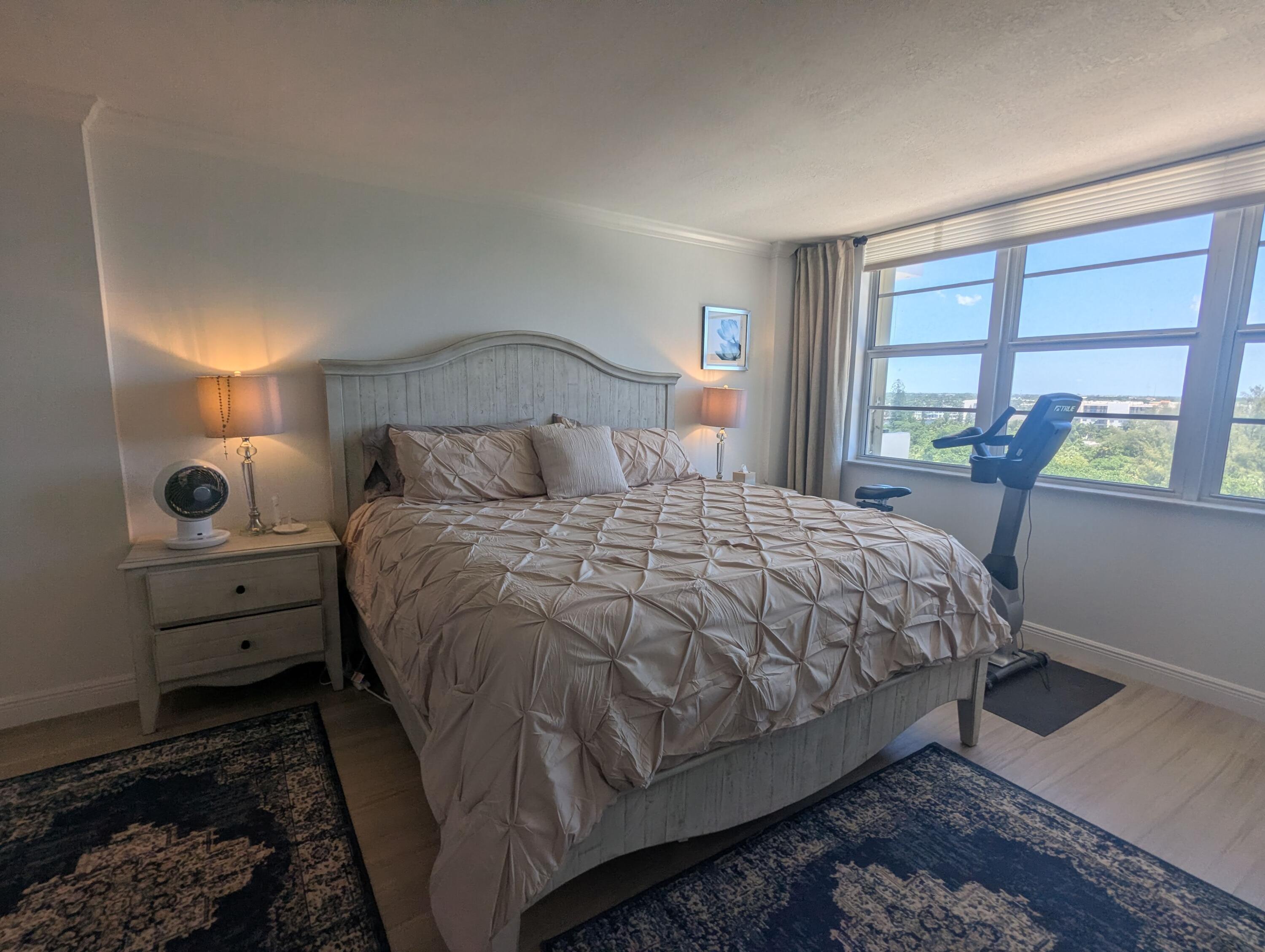 2121 North Ocean Boulevard, Unit 1006E Boca Raton, FL 33431 - Photo 25 of 64 a bedroom with a bed and a large window