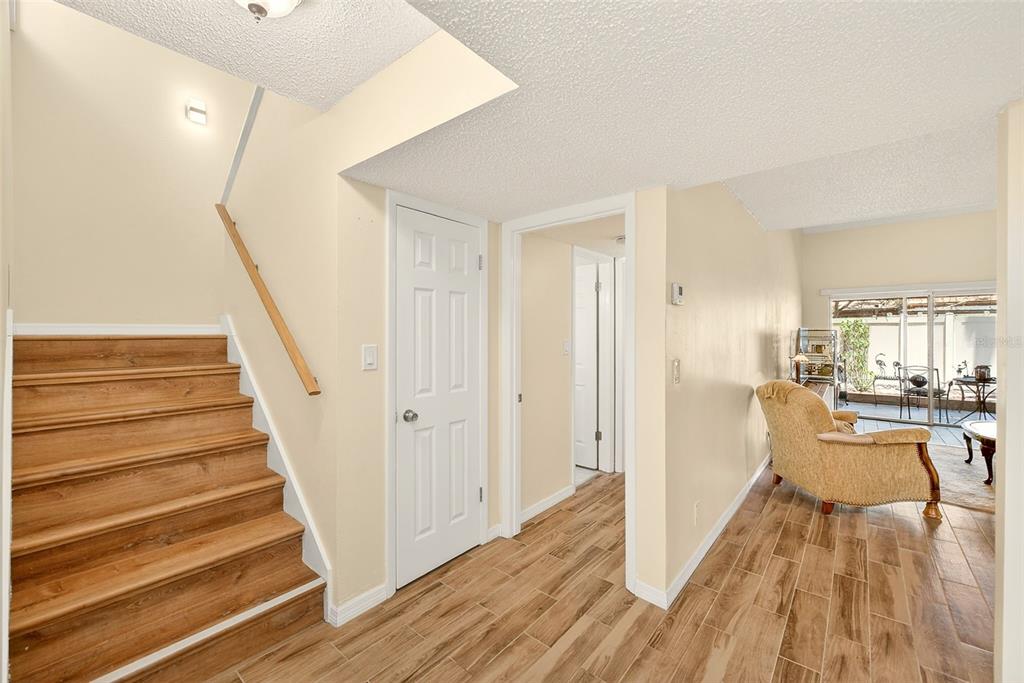 2064 Sunset Point Road, Unit 73 Clearwater, FL 33765 - Photo 9 of 58 a view of a livingroom with wooden floor and furniture