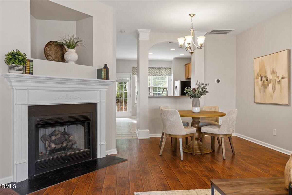 7734 Winners Edge Street Raleigh, NC 27617 - Photo 9 of 37 a living room with furniture and a fireplace