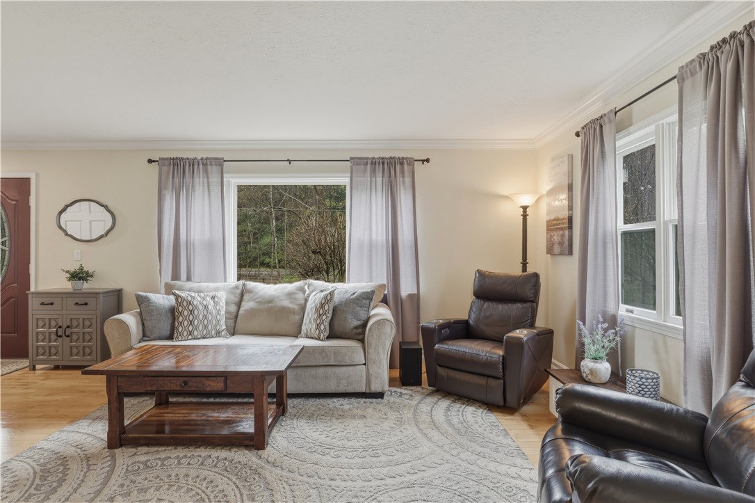 2304 Whiskey Creek Road Corning, NY 14830 - Photo 4 of 42 Just to your left, as you enter the house, the living room offers a spacious place to relax.