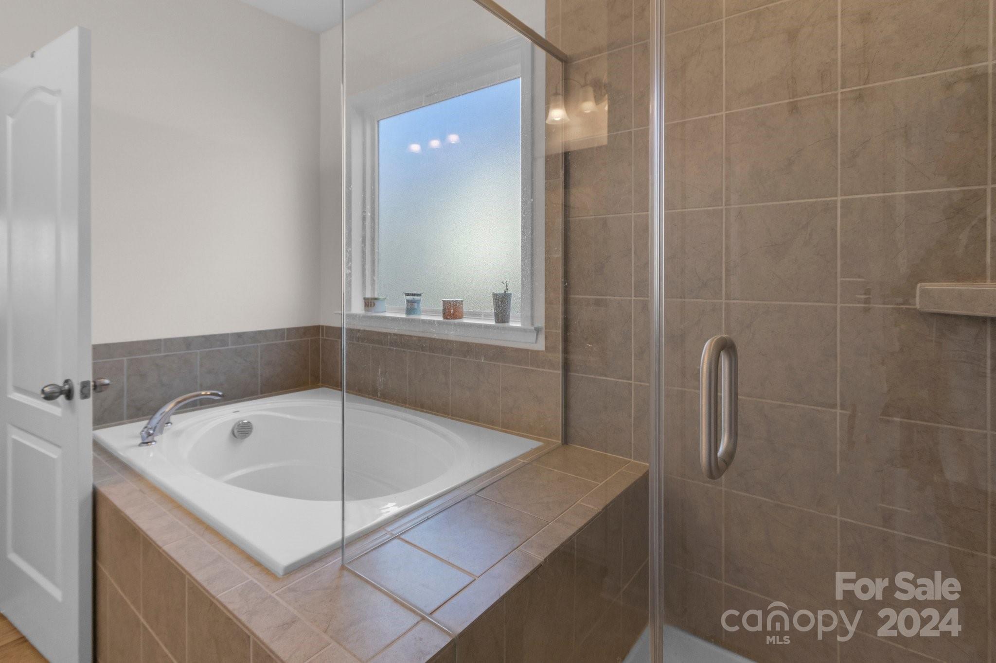 4095 Whittier Lane Fort Mill, SC 29708 - Photo 19 of 30 a bathroom with a bathtub and shower