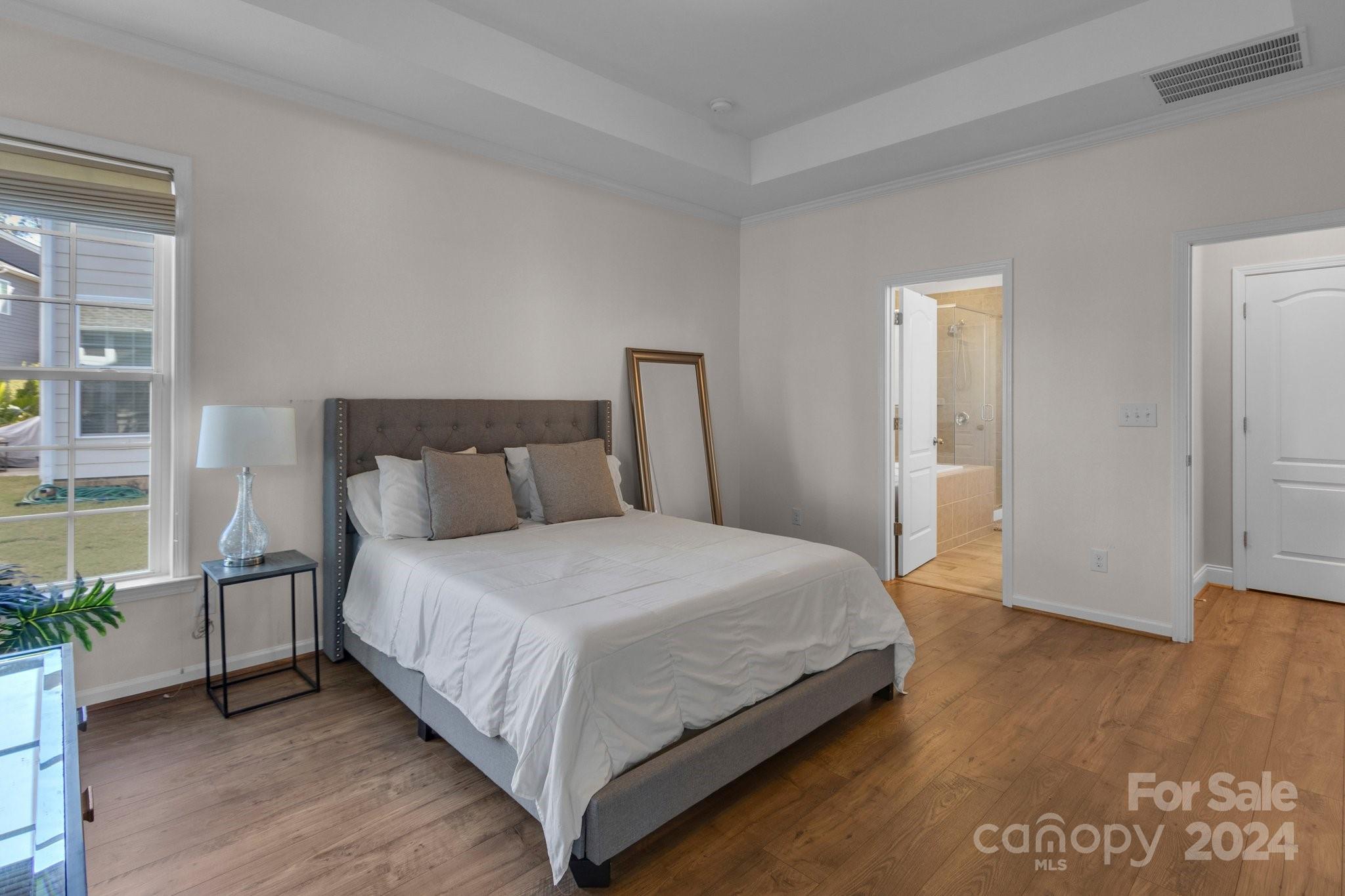 4095 Whittier Lane Fort Mill, SC 29708 - Photo 20 of 30 a bedroom with a large bed and wooden floor