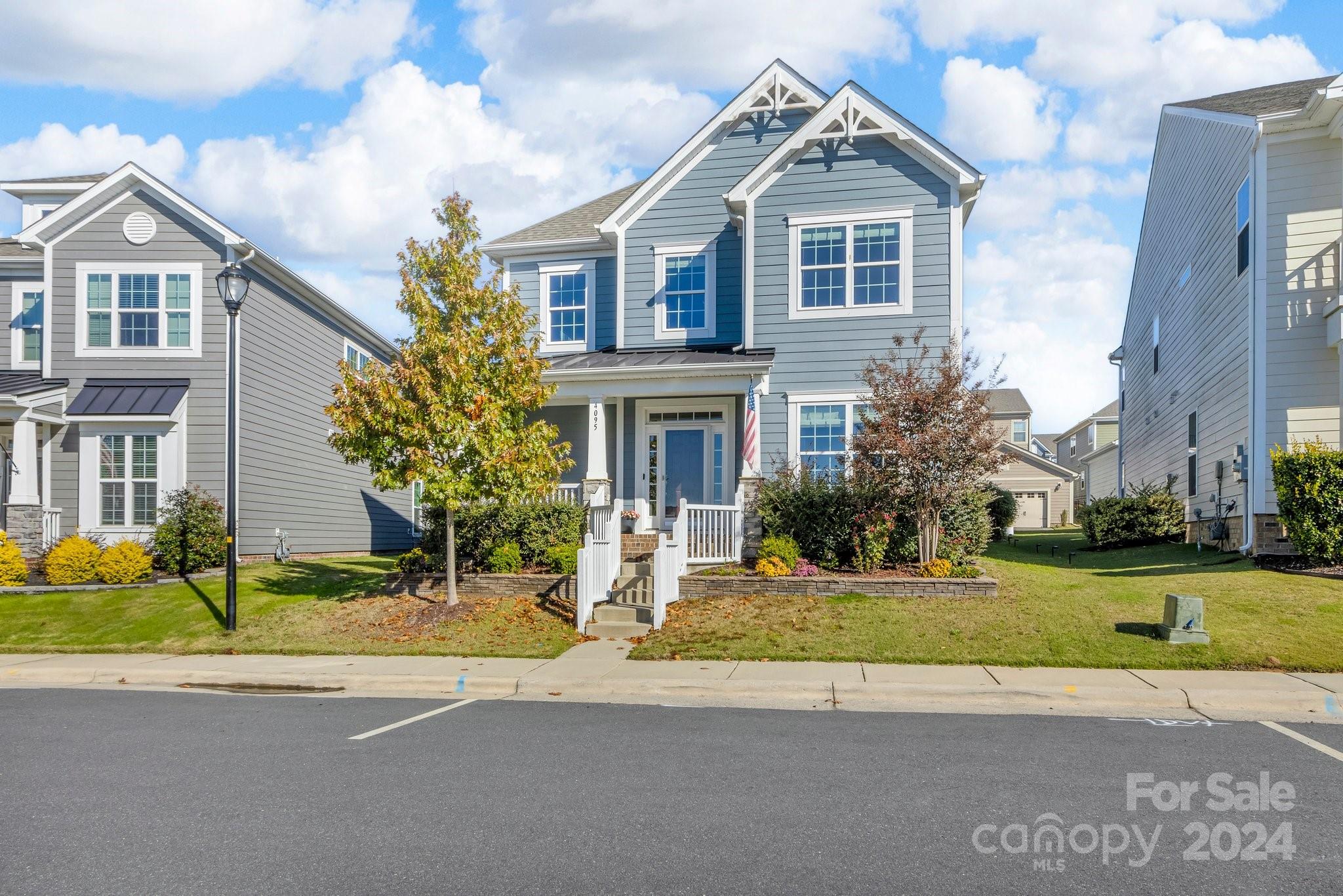 4095 Whittier Lane Fort Mill, SC 29708 - Photo 2 of 30 a front view of a house with a yard and garage