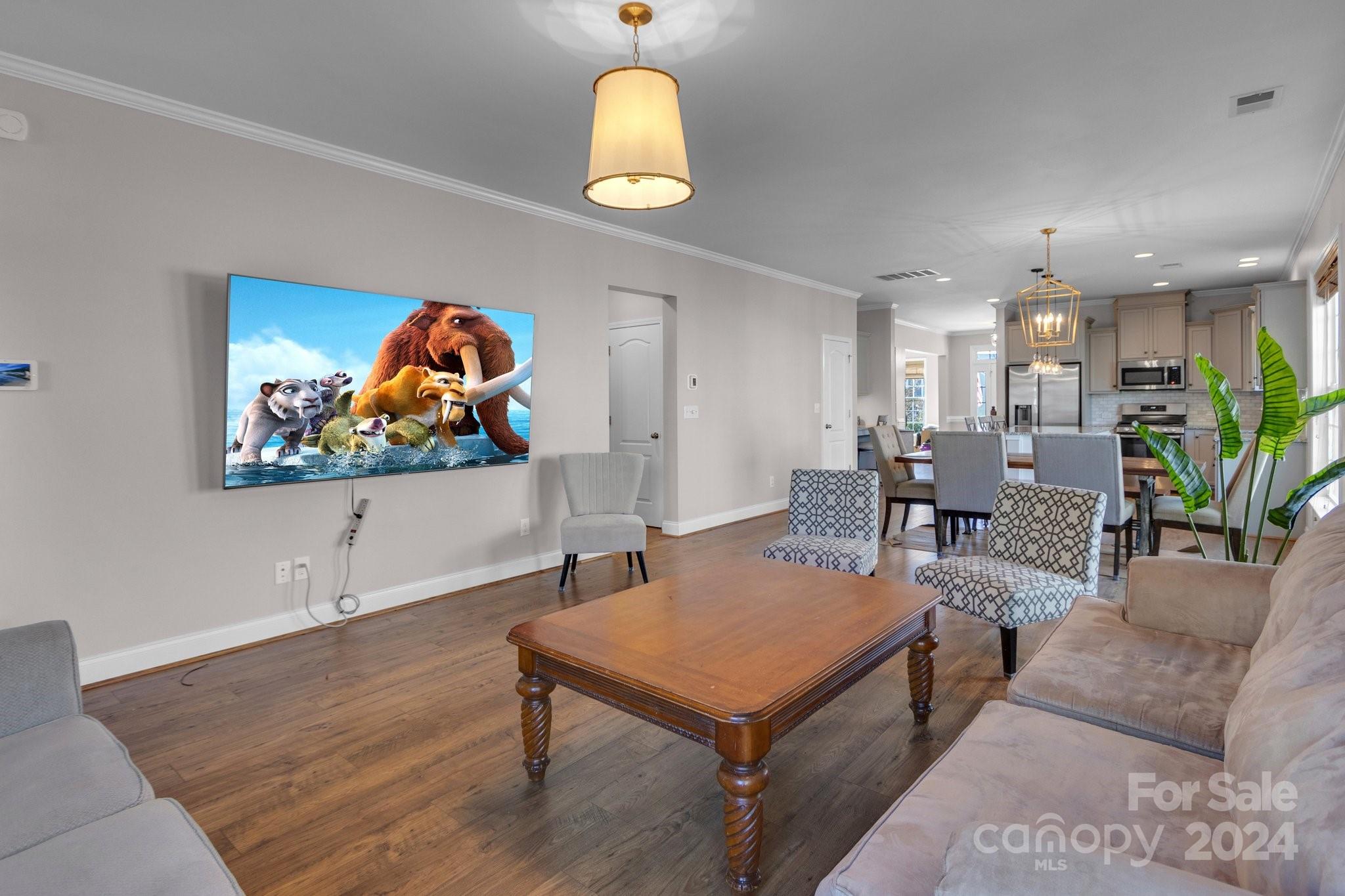 4095 Whittier Lane Fort Mill, SC 29708 - Photo 22 of 30 a living room with furniture a rug and a chandelier