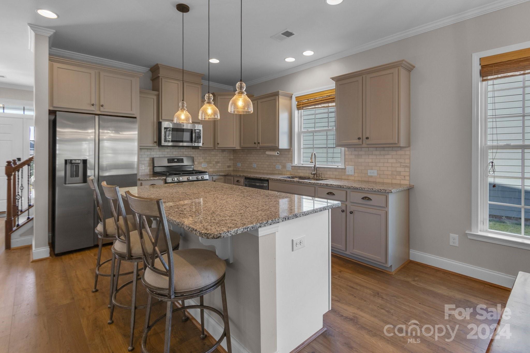 4095 Whittier Lane Fort Mill, SC 29708 - Photo 5 of 30 a kitchen with center island table and chairs