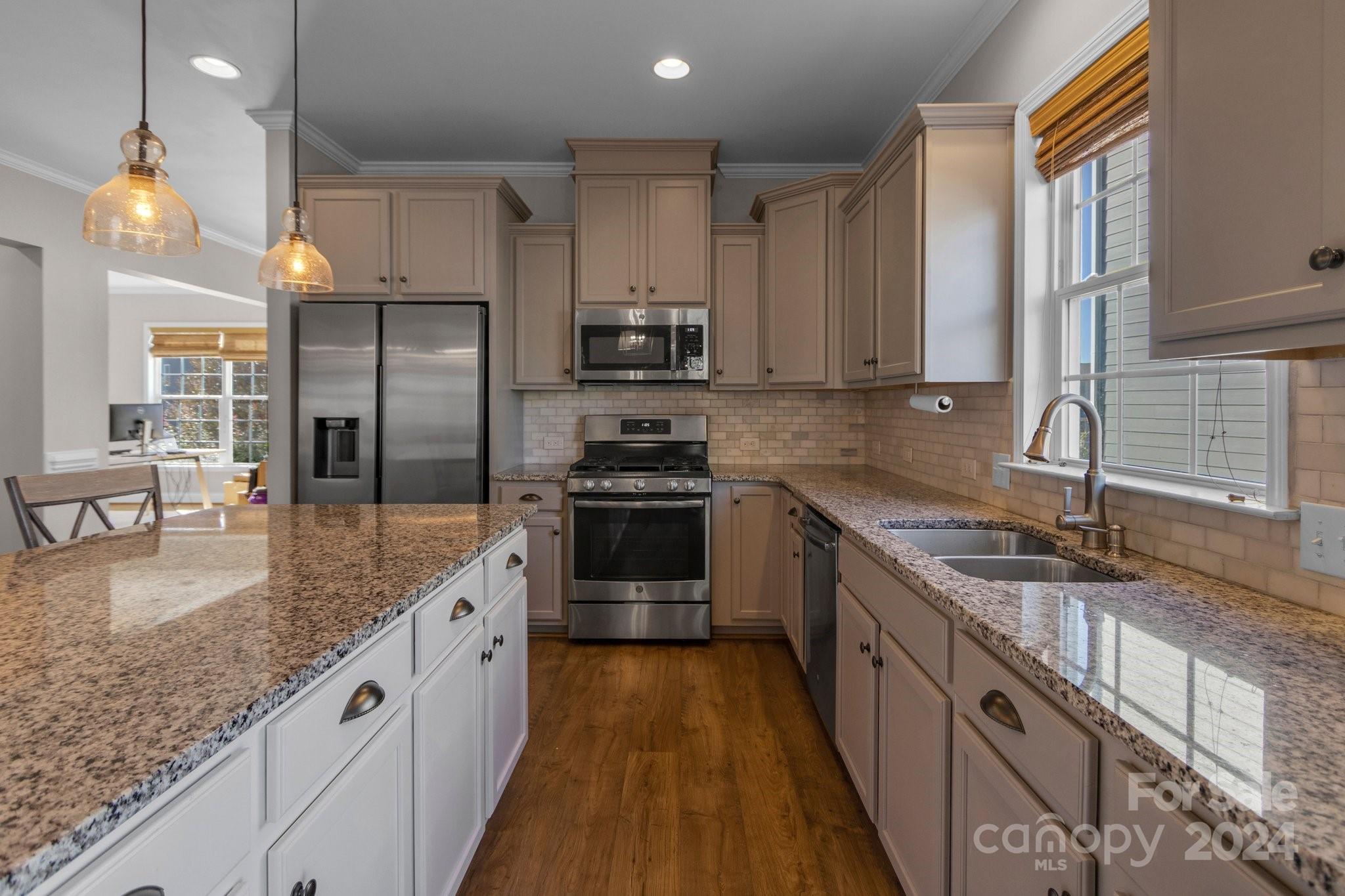 4095 Whittier Lane Fort Mill, SC 29708 - Photo 6 of 30 a kitchen with stainless steel appliances granite countertop a sink a stove and a refrigerator