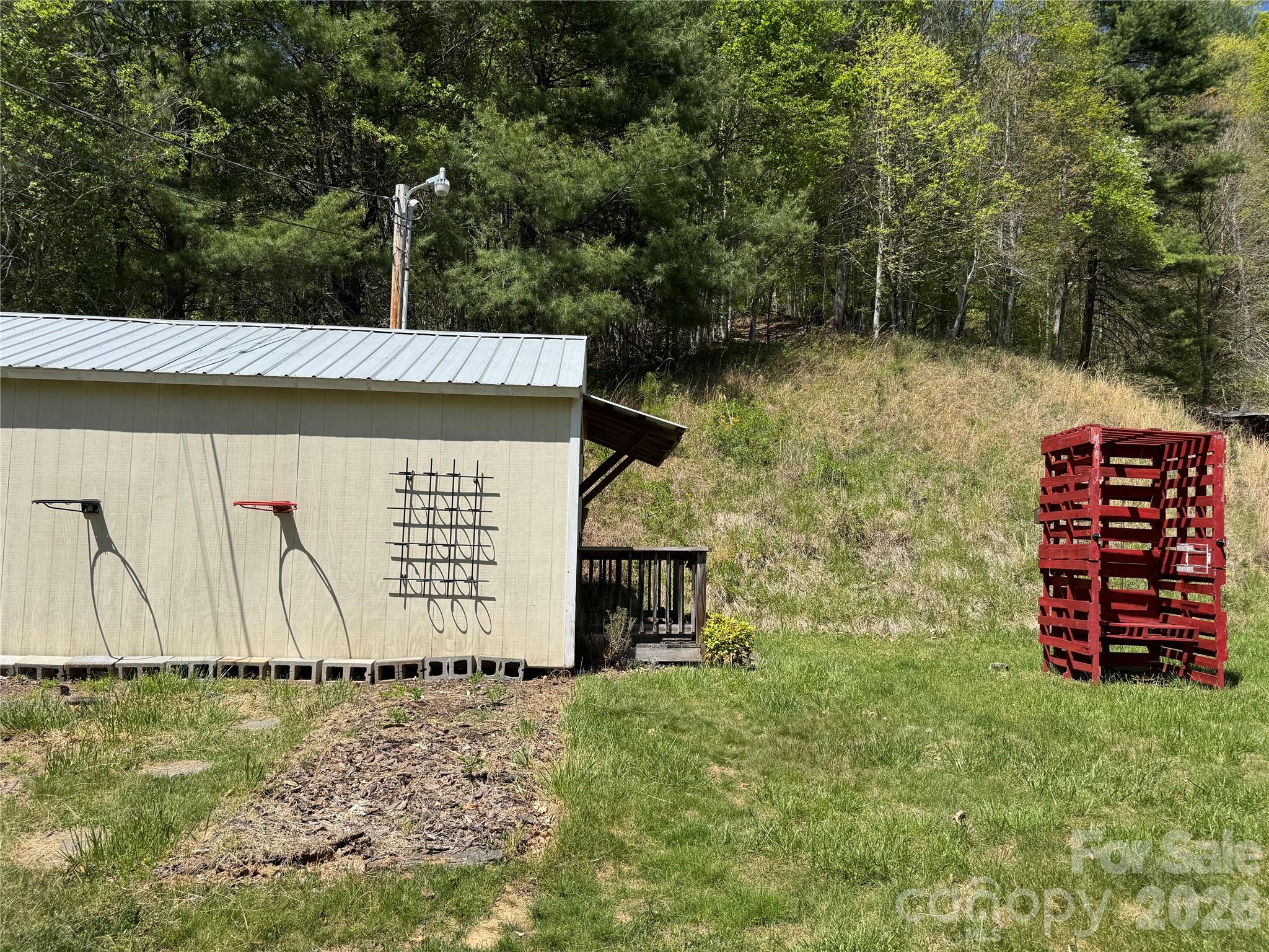 942 Fisher Branch Road Marshall, NC 28753 - Photo 25 of 38 a view of a wooden house with a yard