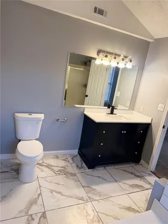 a bathroom with a sink and a toilet