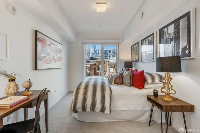 a bed room with furniture and a window