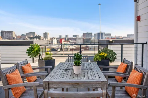 a view of a balcony with sitting area